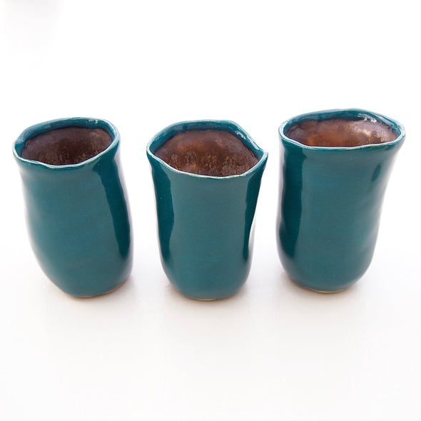 Three teal mini vases