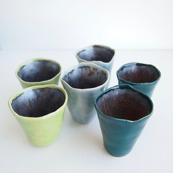 Group of blue and green mini vases