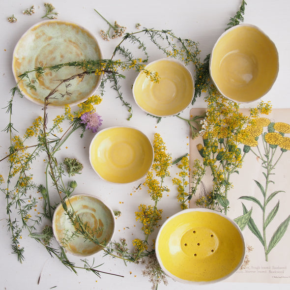 group of yellow ceramics