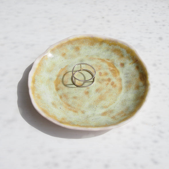 yellow pottery ring dish with ring