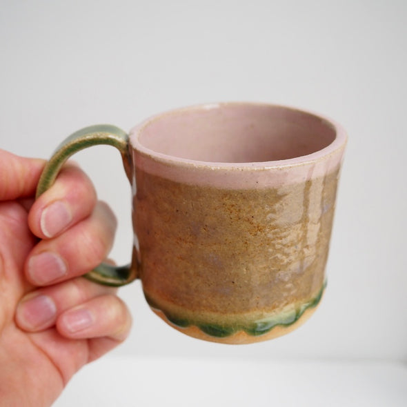 Ceramic mug with pink and green textural glaze