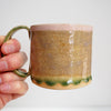 Ceramic mug with pink and green textural glaze