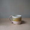 Ceramic mug in pink white and mustard