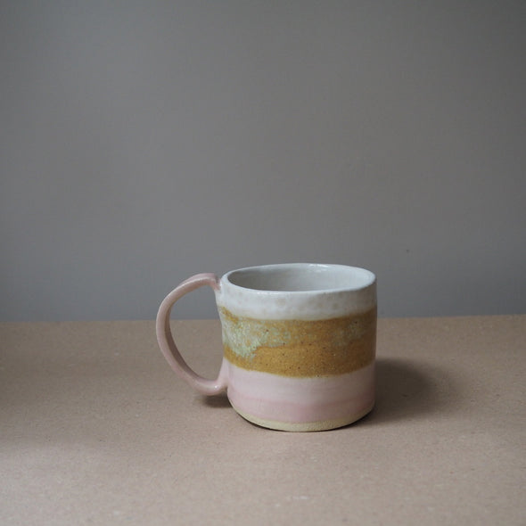 Ceramic mug in pink white and mustard