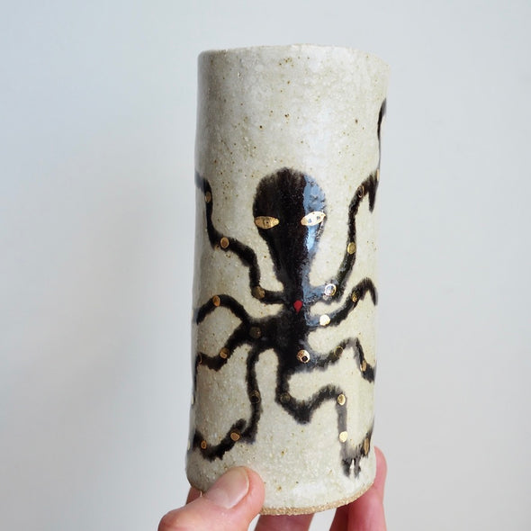 Handmade pottery octopus cylinder vases with gold lustre.