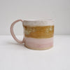 Ceramic mug in pink white and mustard