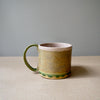 Ceramic mug with pink and green textural glaze