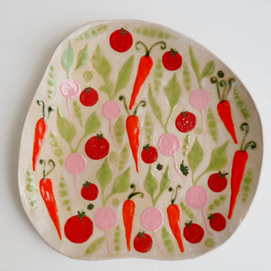 Handmade ceramic plate with carrots tomatoes radishes & peas