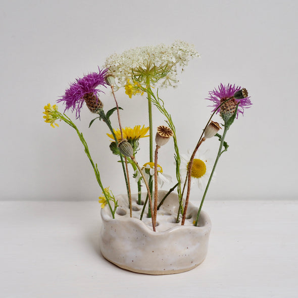 Large white speckled curvy ceramic flower frog