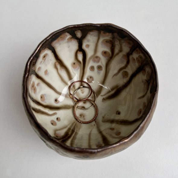 Handmade gold  ceramic ring bowl with swirly dripped glaze