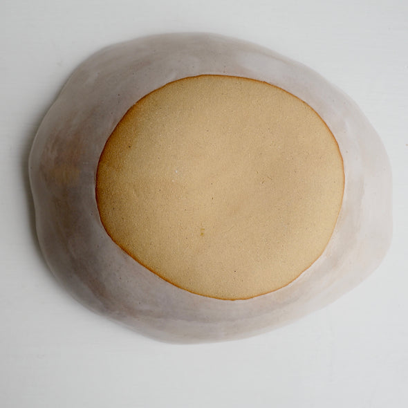 Handmade ceramic fruit bowl with oranges , lemons and limes