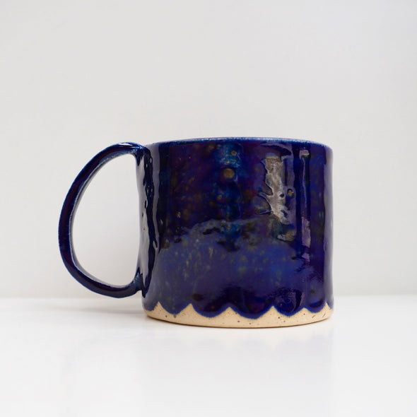 Royal blue ceramic mug with scalloped edge