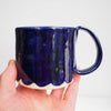 Royal blue ceramic mug with scalloped edge