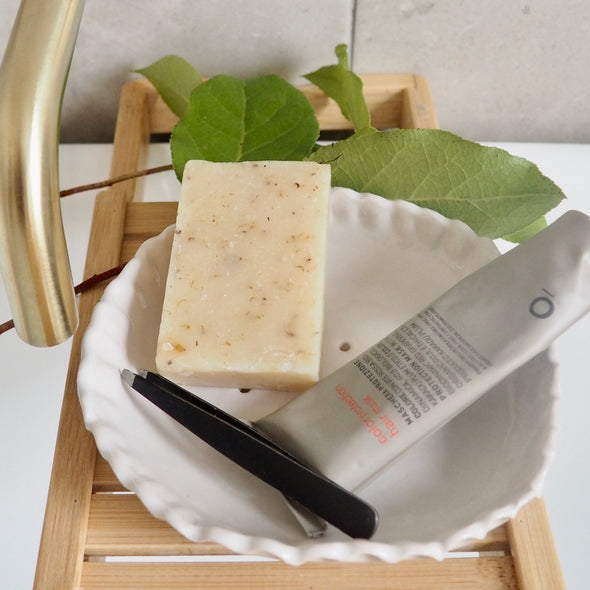 Large handmade white gloss ceramic soap dish with scalloped edges.