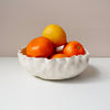 satin white shell textured ceramic bowl with fruit