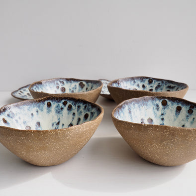Handmade brown pottery cereal bowl with cream / blue speckled glaze