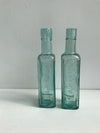 Vintage green glass sauce bottles