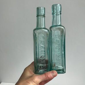 Vintage green glass sauce bottles