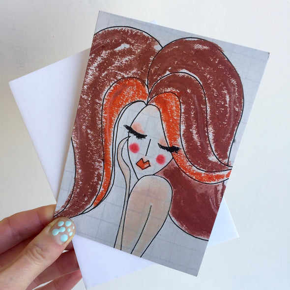 holding red hair girl birthday card with envelope
