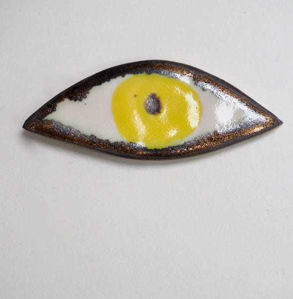 yellow ceramic eye pin badge