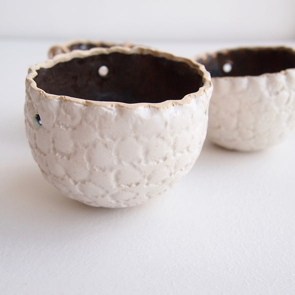 Handmade round white textural small hanging planter with gold inside