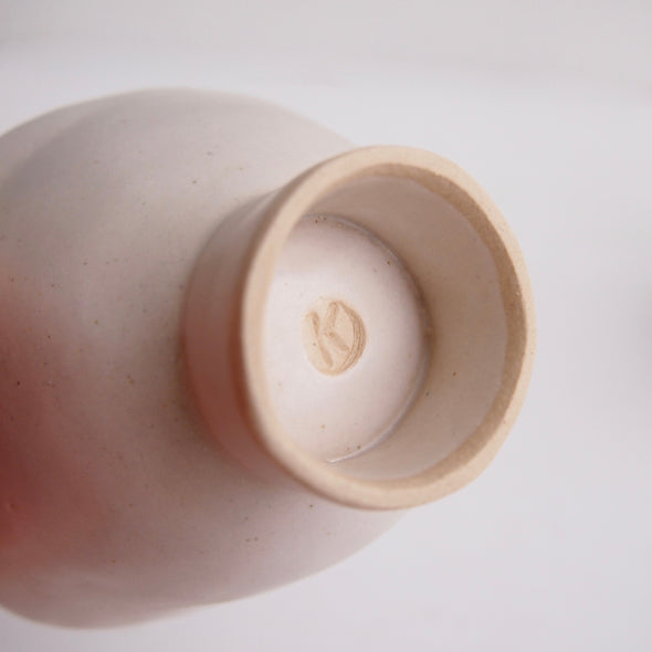 Handmade satin white ceramic ring dish with a cylinder base