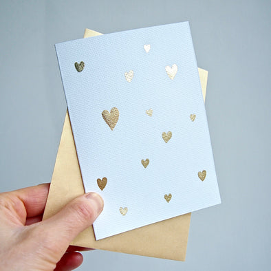 Gold leaf handmade Valentines card with many mini hearts