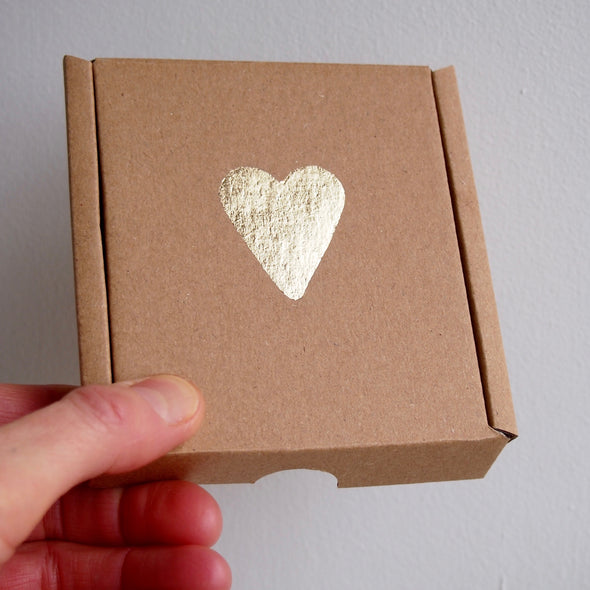Handmade gold heart ceramic brooch.