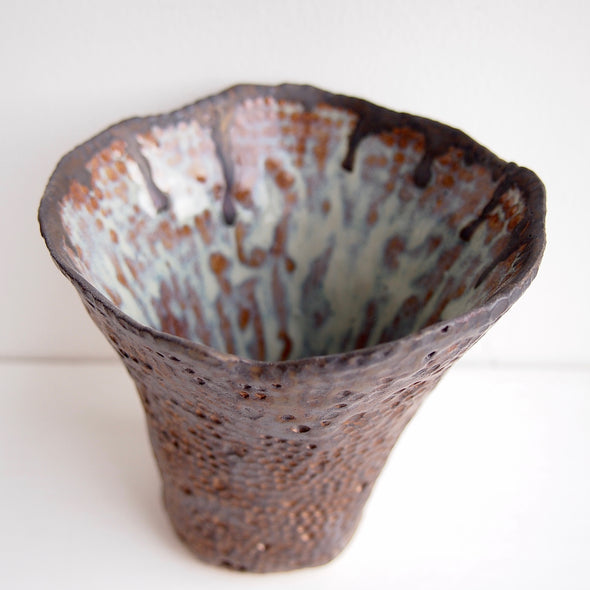 Handmade bronze dot ceramic vase with blue brown swirly interior