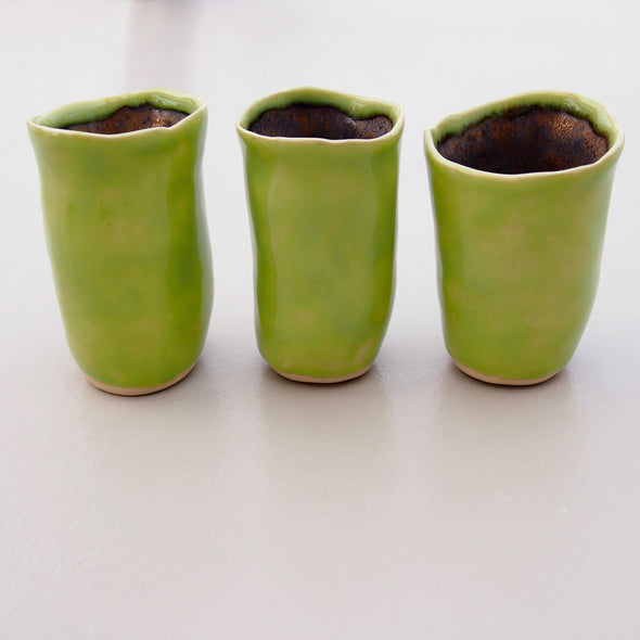 Three spring green mini vases
