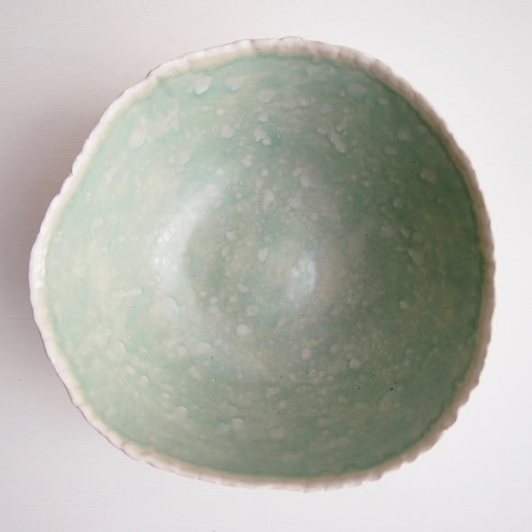 inside of turquoise and white fruit bowl