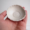 Handmade mini white pottery salt and pepper dish with scalloped edge