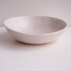 Side of cream speckled pottery cereal bowl