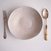 Cream speckled pottery cereal bowl