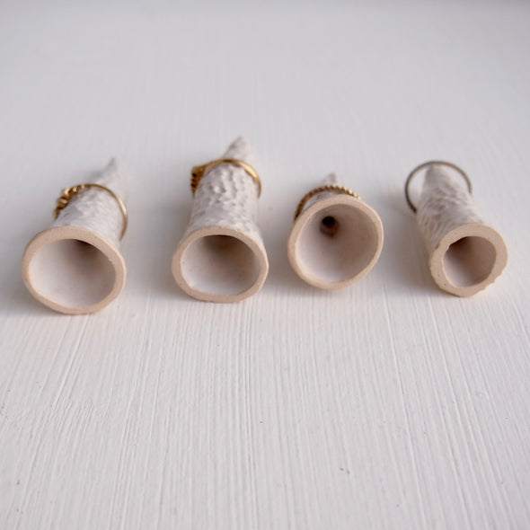 Underside of gloss white circle texture ring cones.
