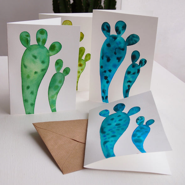 Original watercolour cactus card paintings in green and blue.