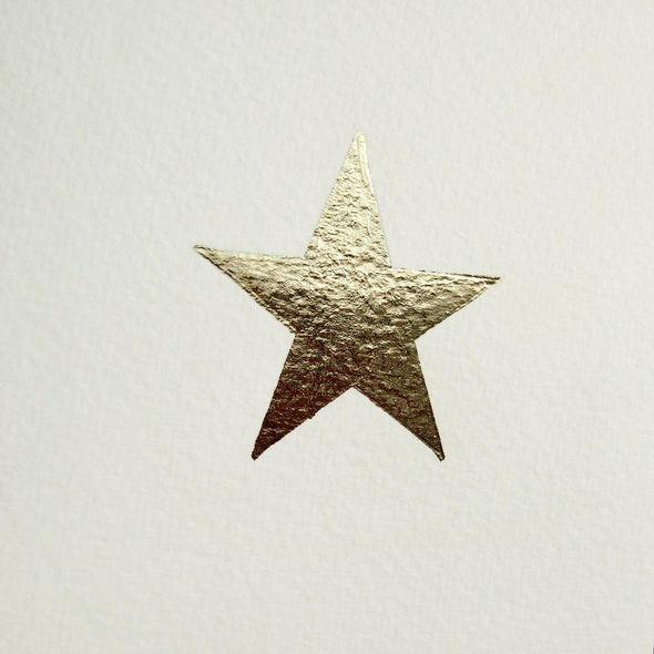 close up of gold leaf christmas star