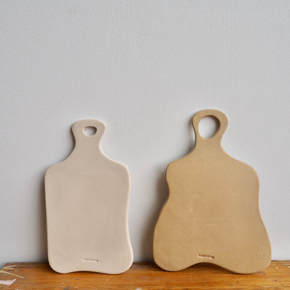 Handmade curvy pottery cheeseboards