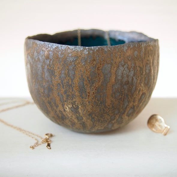 Teal and gold pottery ring bowl with jewellery