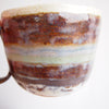 glaze up close handmade brown, blue, turquoise and gold mug