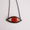 Handmade ceramic orange eye pendant necklace