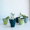 Group of blue and green mini vases