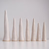 Row of Satin white pottery ring cones