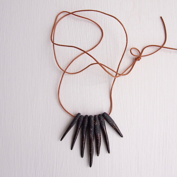 Black ceramic arrowhead necklace with leather cord