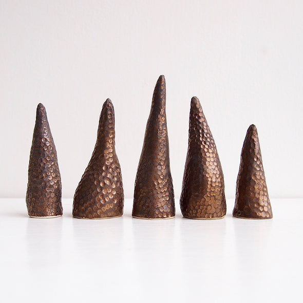 Handmade black/gold textural ceramic ring cones