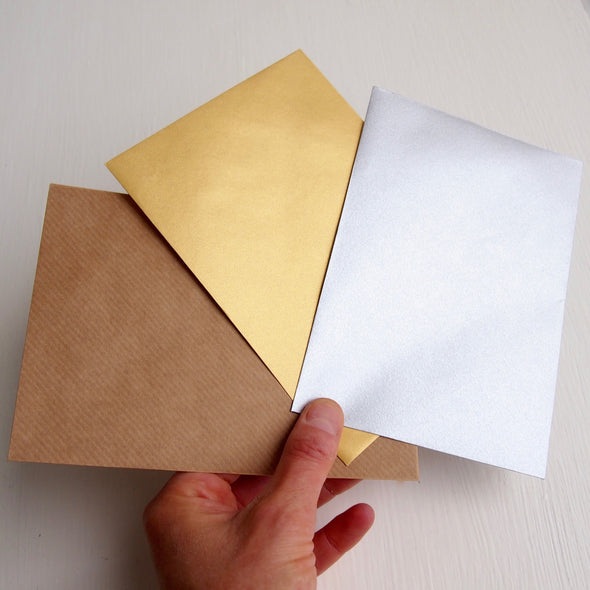 gold silver and brown kraft envelopes