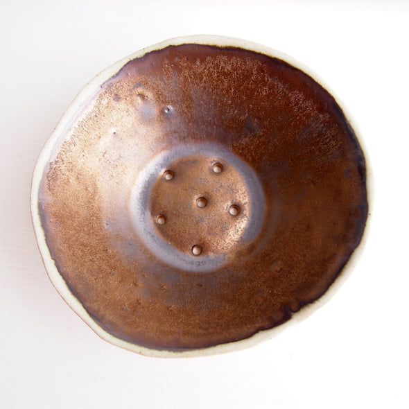 large round gold soap dish top view