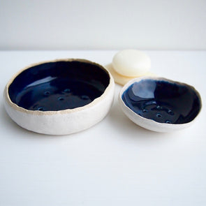 navy and white pottery soap dishes