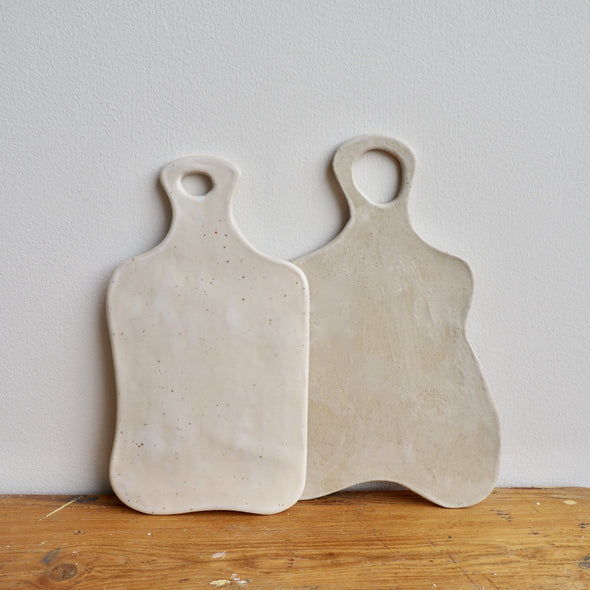 Handmade small curvy pottery cheeseboards