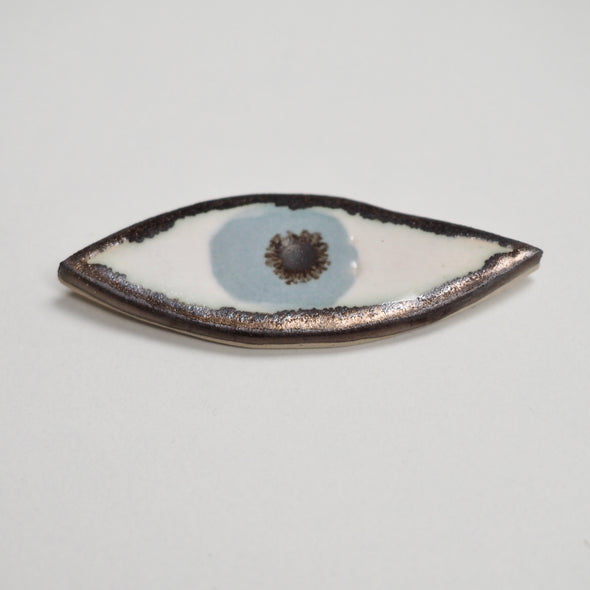 powder-blue ceramic eye brooch